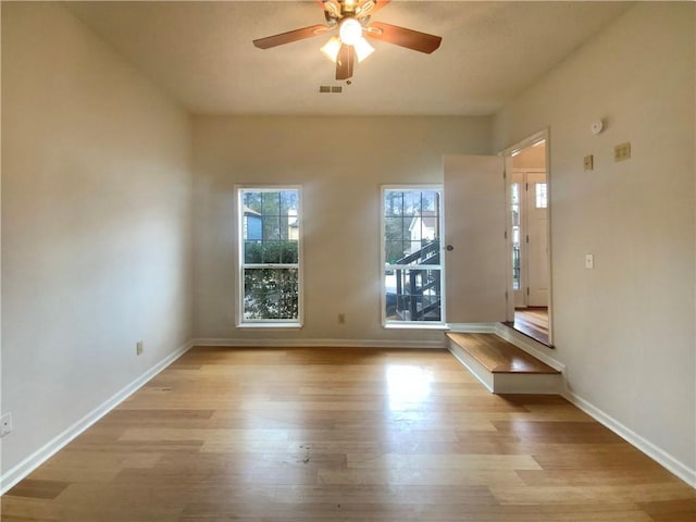 unfurnished room featuring ceiling fan and light hardwood / wood-style floors