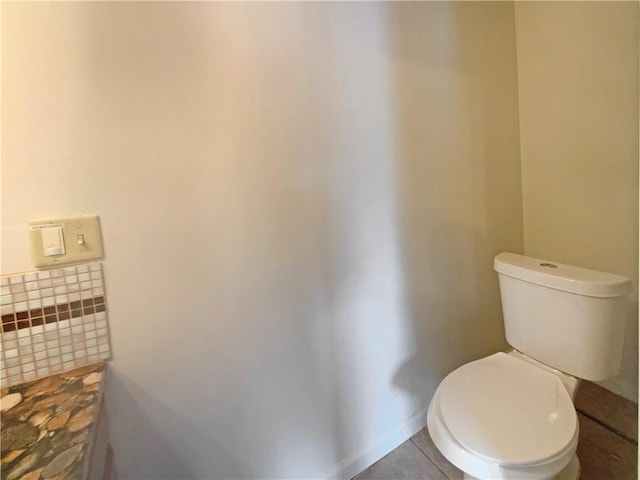 bathroom featuring tile patterned floors and toilet