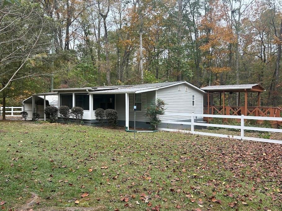 ranch-style home with a front lawn