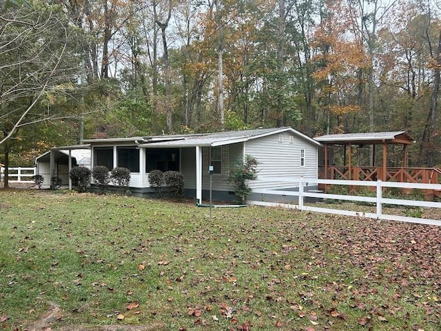 ranch-style home with a front lawn