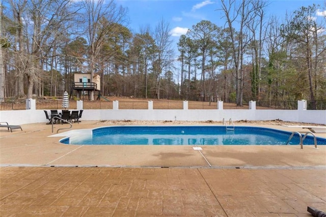 view of pool with a patio, fence, and a fenced in pool