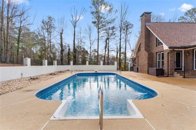 view of swimming pool with a fenced in pool, fence private yard, and a patio area