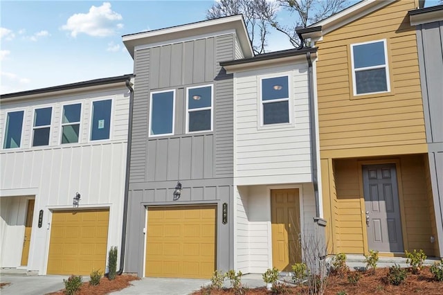 view of property featuring board and batten siding and a garage