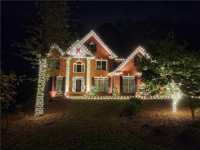 view of front of home featuring brick siding