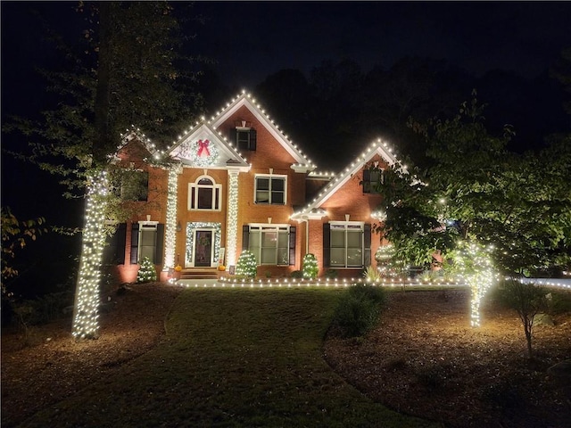 view of front of house with brick siding