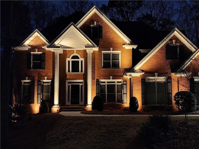 view of front of home featuring brick siding