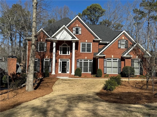 view of front of house with brick siding