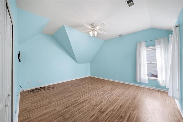 bonus room with ceiling fan, vaulted ceiling, and light hardwood / wood-style floors