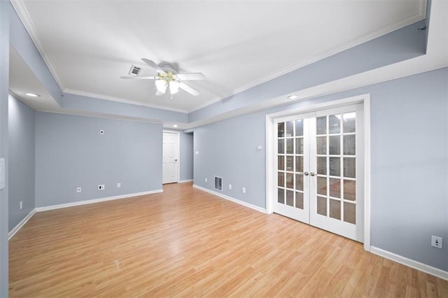 unfurnished room featuring crown molding, french doors, ceiling fan, and light wood-type flooring