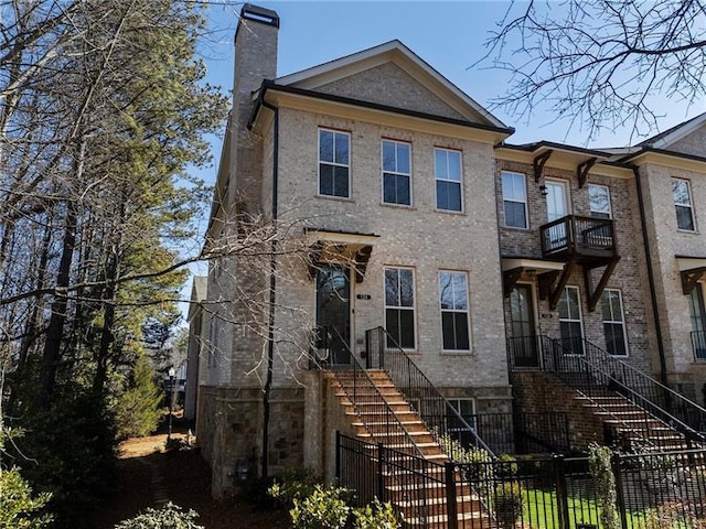 124 Everley Walk, Alpharetta, GA 30009 - view of front of property featuring a chimney, stairs, and brick siding