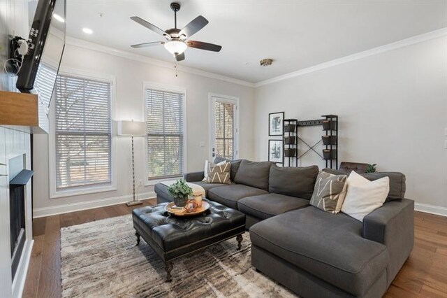 124 Everley Walk, Alpharetta, GA 30009 - living area with baseboards, a ceiling fan, a fireplace, wood finished floors, and ornamental molding