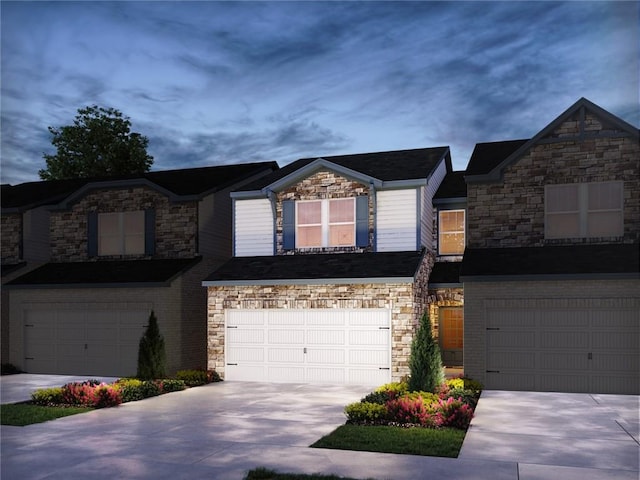 348 White Tail Rd, Stockbridge, GA 30253 - townhome / multi-family property featuring stone siding, concrete driveway, and a garage