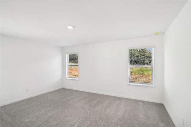 348 White Tail Rd, Stockbridge, GA 30253 - spare room featuring baseboards, carpet flooring, and recessed lighting