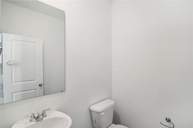 348 White Tail Rd, Stockbridge, GA 30253 - bathroom featuring toilet and a sink