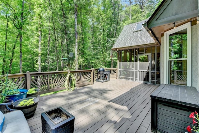 1595 Northcliff Trce, Roswell, GA 30076 - wooden terrace with a sunroom and a forest view