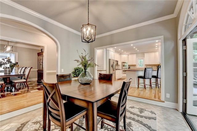 1595 Northcliff Trce, Roswell, GA 30076 - dining room featuring ornamental molding, a chandelier, arched walkways, baseboards, and recessed lighting