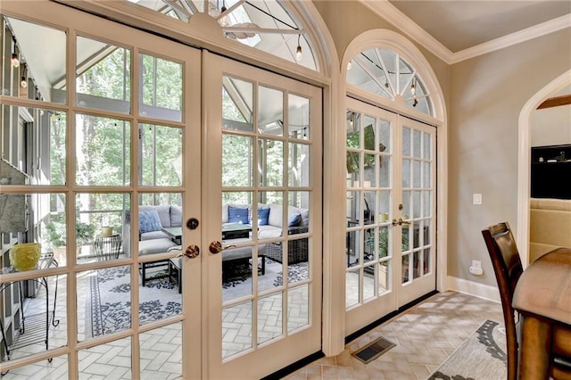 1595 Northcliff Trce, Roswell, GA 30076 - entryway with french doors, crown molding, arched walkways, and baseboards