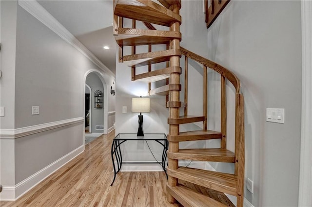 1595 Northcliff Trce, Roswell, GA 30076 - staircase with arched walkways, ornamental molding, wood finished floors, baseboards, and recessed lighting
