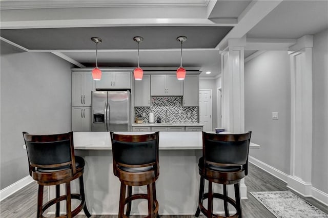 1595 Northcliff Trce, Roswell, GA 30076 - kitchen with stainless steel fridge with ice dispenser, dark wood-style floors, light countertops, ornamental molding, and recessed lighting