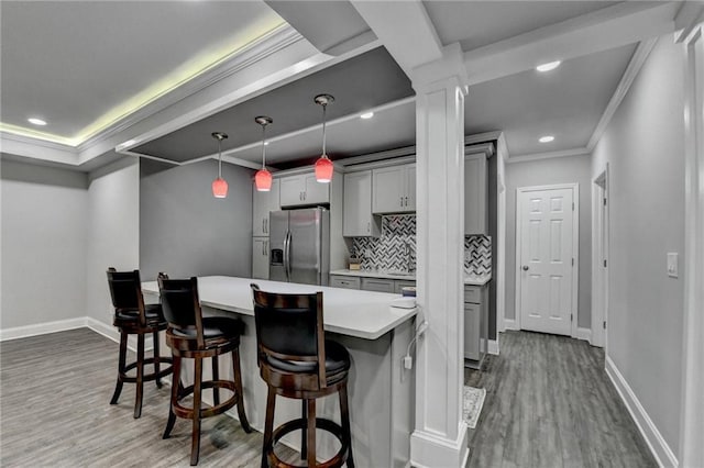 1595 Northcliff Trce, Roswell, GA 30076 - kitchen featuring stainless steel refrigerator with ice dispenser, gray cabinets, dark wood-style floors, light countertops, and crown molding