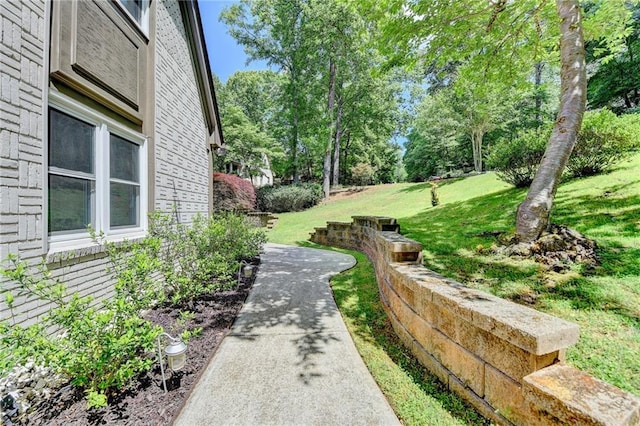 1595 Northcliff Trce, Roswell, GA 30076 - view of home's exterior featuring stucco siding, a shingled roof, and driveway
