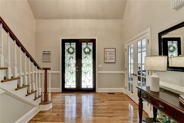 1595 Northcliff Trce, Roswell, GA 30076 - foyer entrance featuring french doors, stairway, wood finished floors, and a towering ceiling