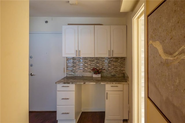 kitchen with white cabinetry and decorative backsplash