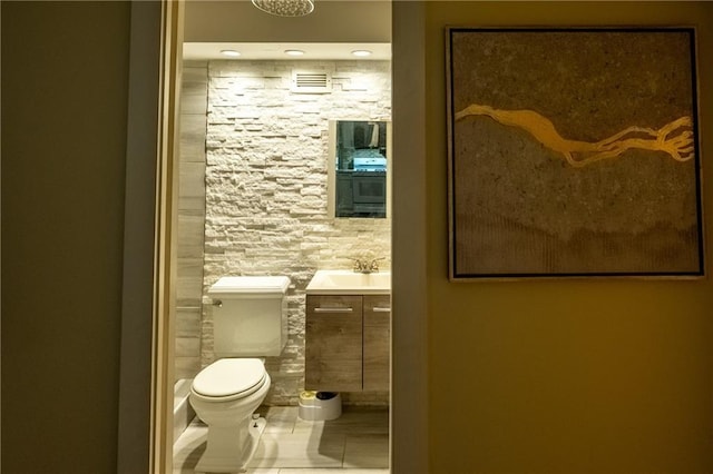 bathroom with vanity, tile patterned floors, and toilet