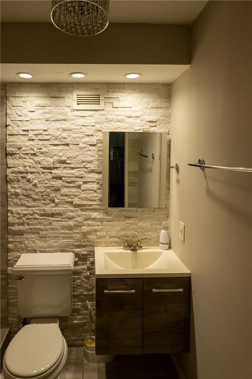 bathroom with vanity and toilet