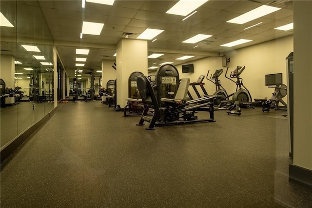 workout area featuring a paneled ceiling