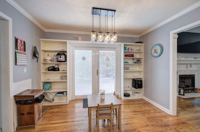 20 Friendship Rd, Euharlee, GA 30145 - dining room with a textured ceiling, light wood finished floors, ornamental molding, and a chandelier