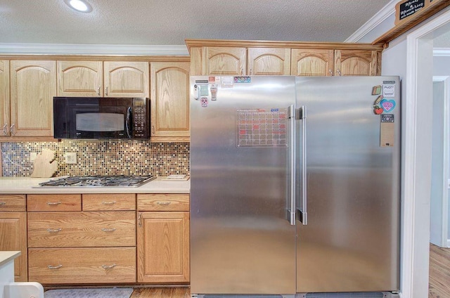 20 Friendship Rd, Euharlee, GA 30145 - kitchen with stainless steel appliances, light countertops, light brown cabinetry, ornamental molding, and decorative backsplash