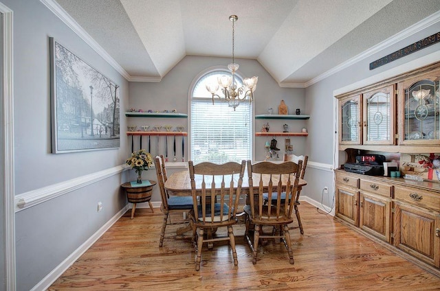 20 Friendship Rd, Euharlee, GA 30145 - dining room featuring a chandelier, vaulted ceiling, light wood-type flooring, ornamental molding, and a textured ceiling