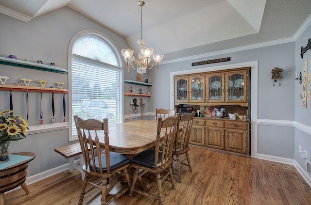 20 Friendship Rd, Euharlee, GA 30145 - dining area with lofted ceiling, light wood-style flooring, a chandelier, and crown molding
