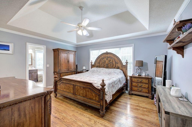 20 Friendship Rd, Euharlee, GA 30145 - bedroom with a raised ceiling, light wood-style flooring, connected bathroom, a ceiling fan, and ornamental molding