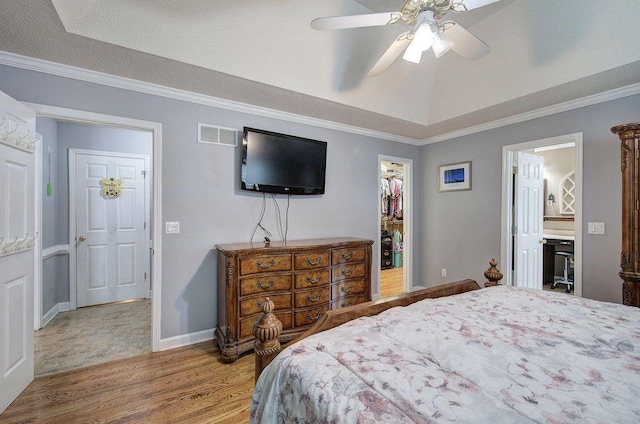 20 Friendship Rd, Euharlee, GA 30145 - bedroom with wood finished floors, a walk in closet, crown molding, a closet, and ceiling fan