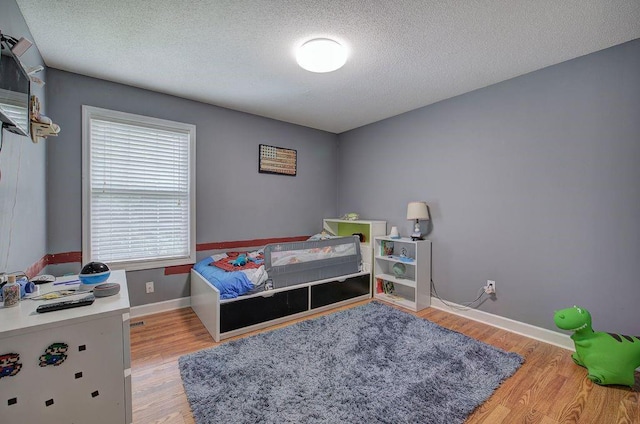 20 Friendship Rd, Euharlee, GA 30145 - bedroom with light wood-style flooring and a textured ceiling