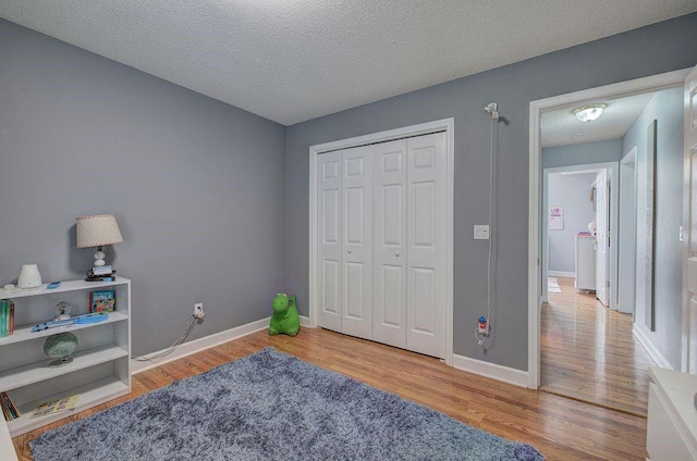 20 Friendship Rd, Euharlee, GA 30145 - bedroom with wood finished floors, a closet, and a textured ceiling