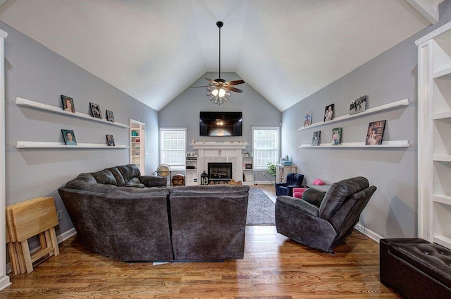 20 Friendship Rd, Euharlee, GA 30145 - living room featuring a ceiling fan, a fireplace, wood finished floors, vaulted ceiling, and built in features
