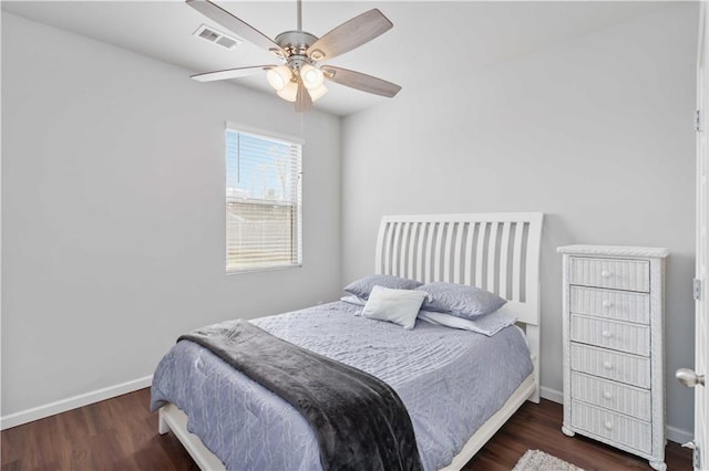 bedroom with ceiling fan and dark hardwood / wood-style floors