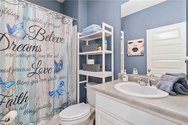 full bathroom with vanity, toilet, and shower / bath combo with shower curtain