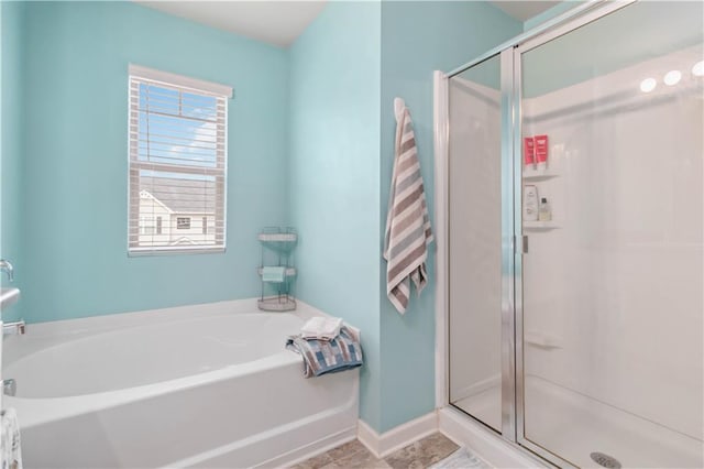 bathroom with shower with separate bathtub