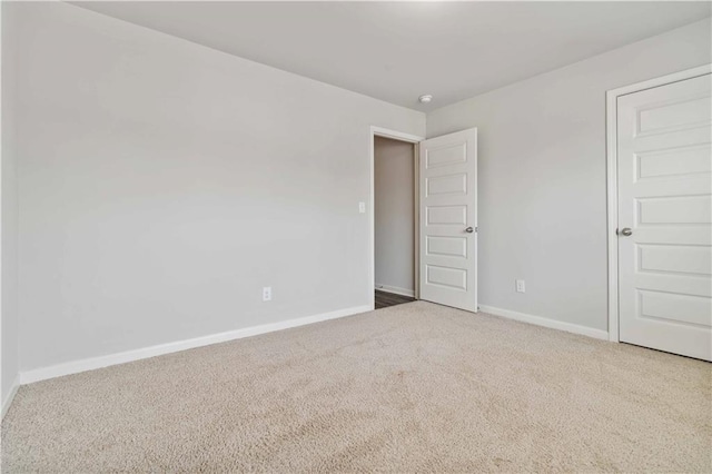 empty room featuring carpet flooring