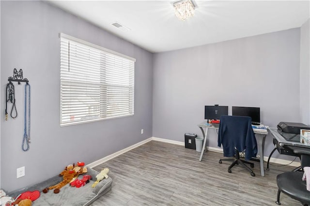 office with hardwood / wood-style flooring