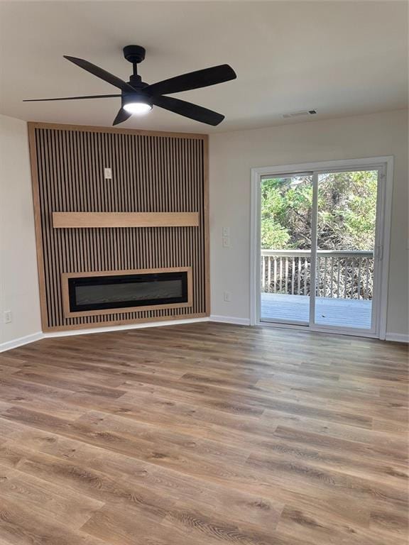 unfurnished living room with wood-type flooring