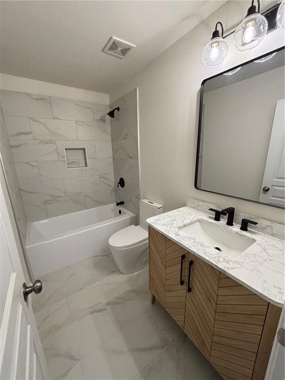 full bathroom featuring tiled shower / bath combo, vanity, and toilet