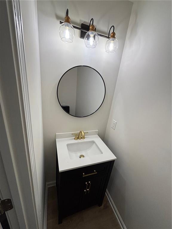 bathroom featuring vanity and wood-type flooring