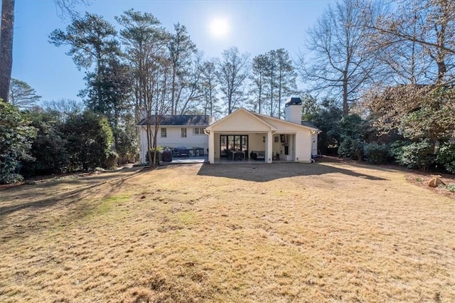 back of property featuring a patio