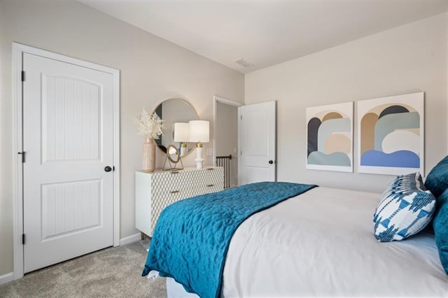 bedroom with baseboards and carpet flooring