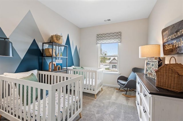 carpeted bedroom with baseboards and visible vents